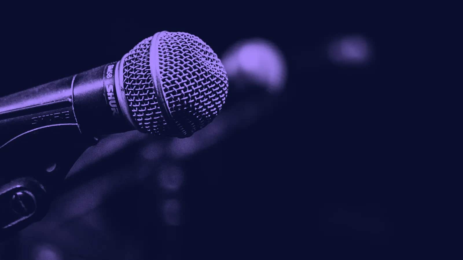 A close-up of a stage microphone