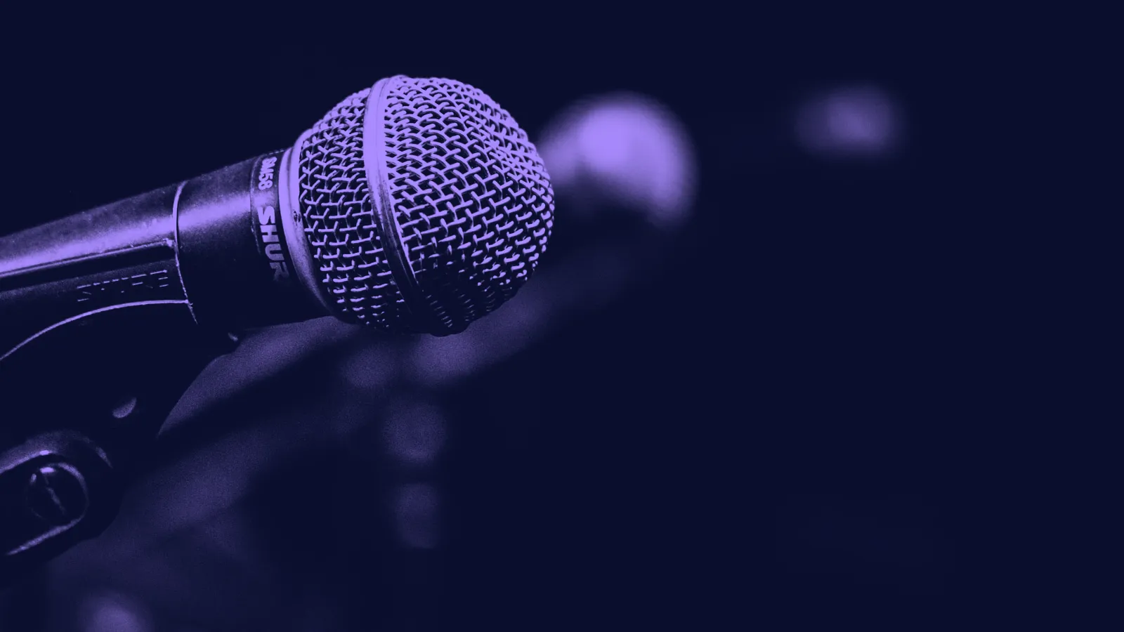 A close-up of a stage microphone